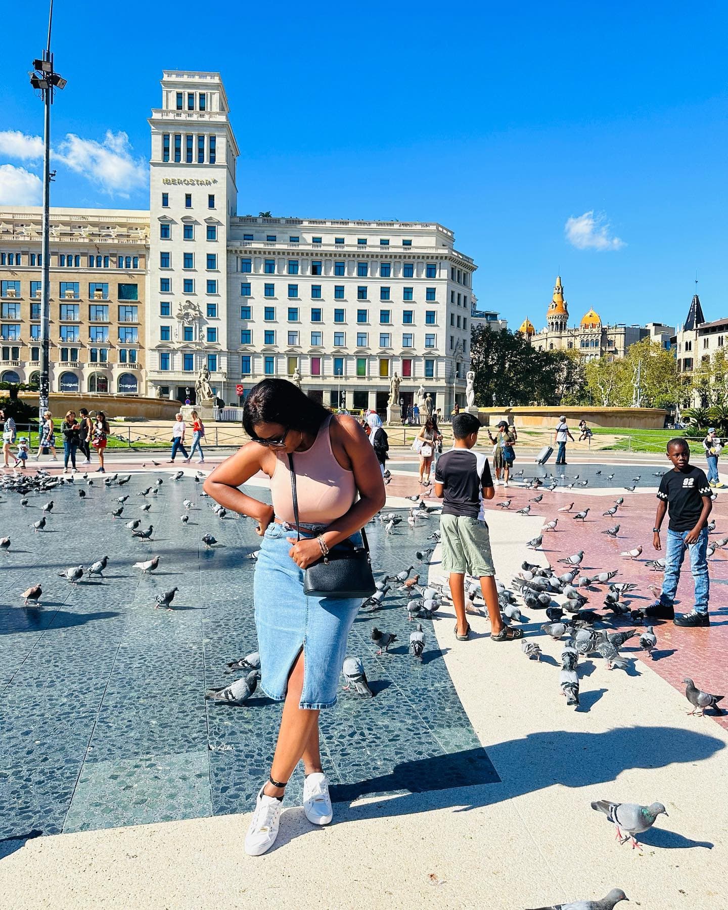 Malorfa among pigeons in a Barcelona plaza