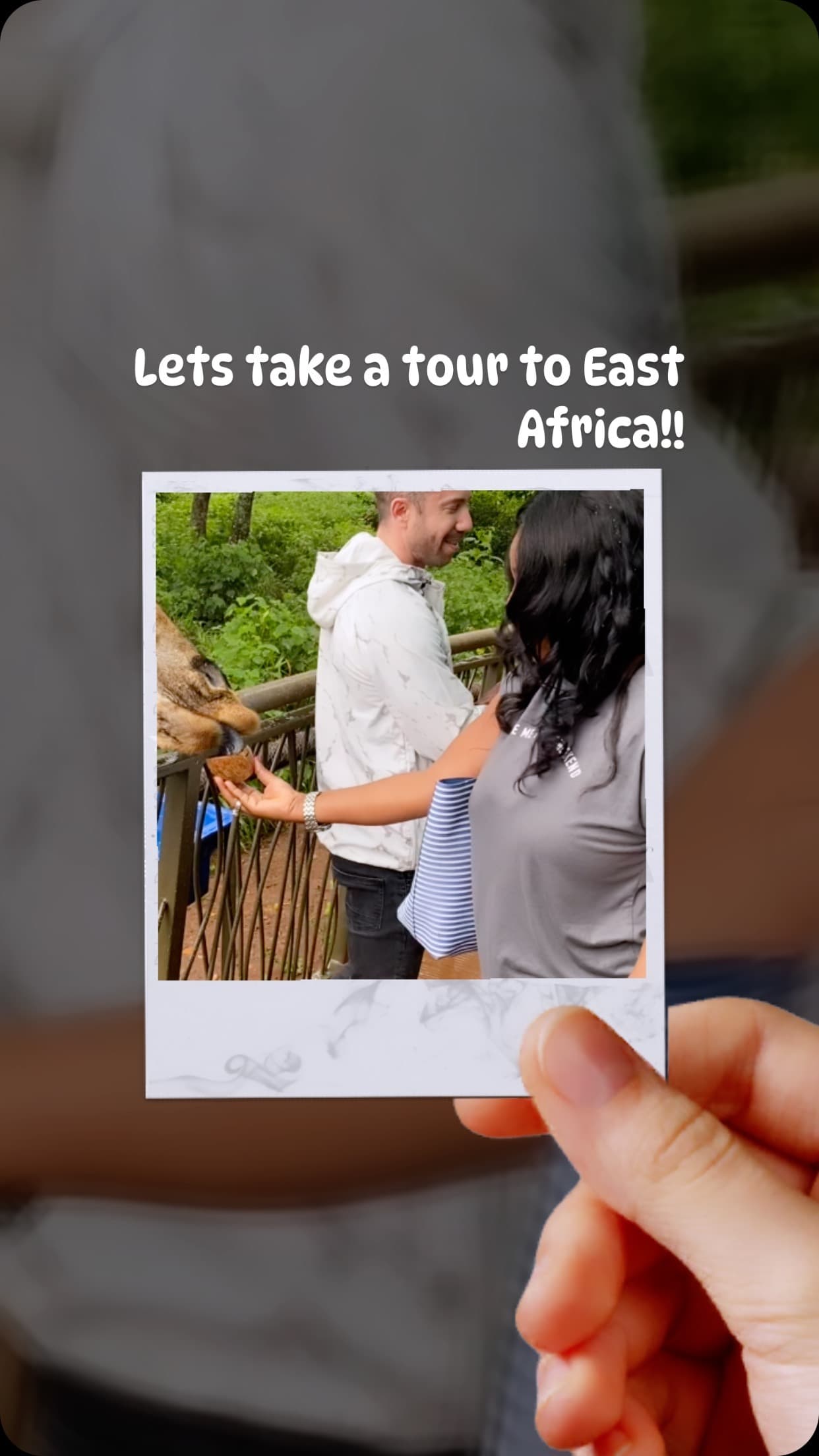 Malorfa feeding a giraffe in East Africa