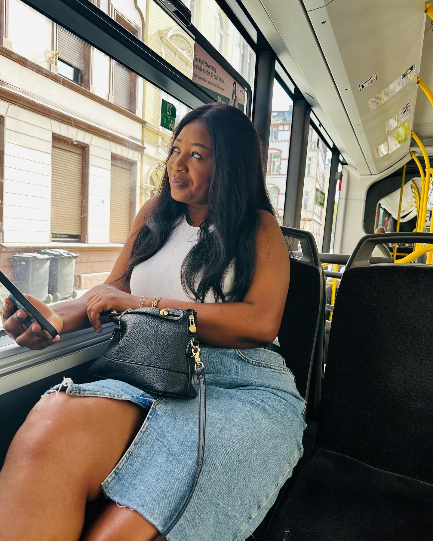 Malorfa looking out a tram window while traveling